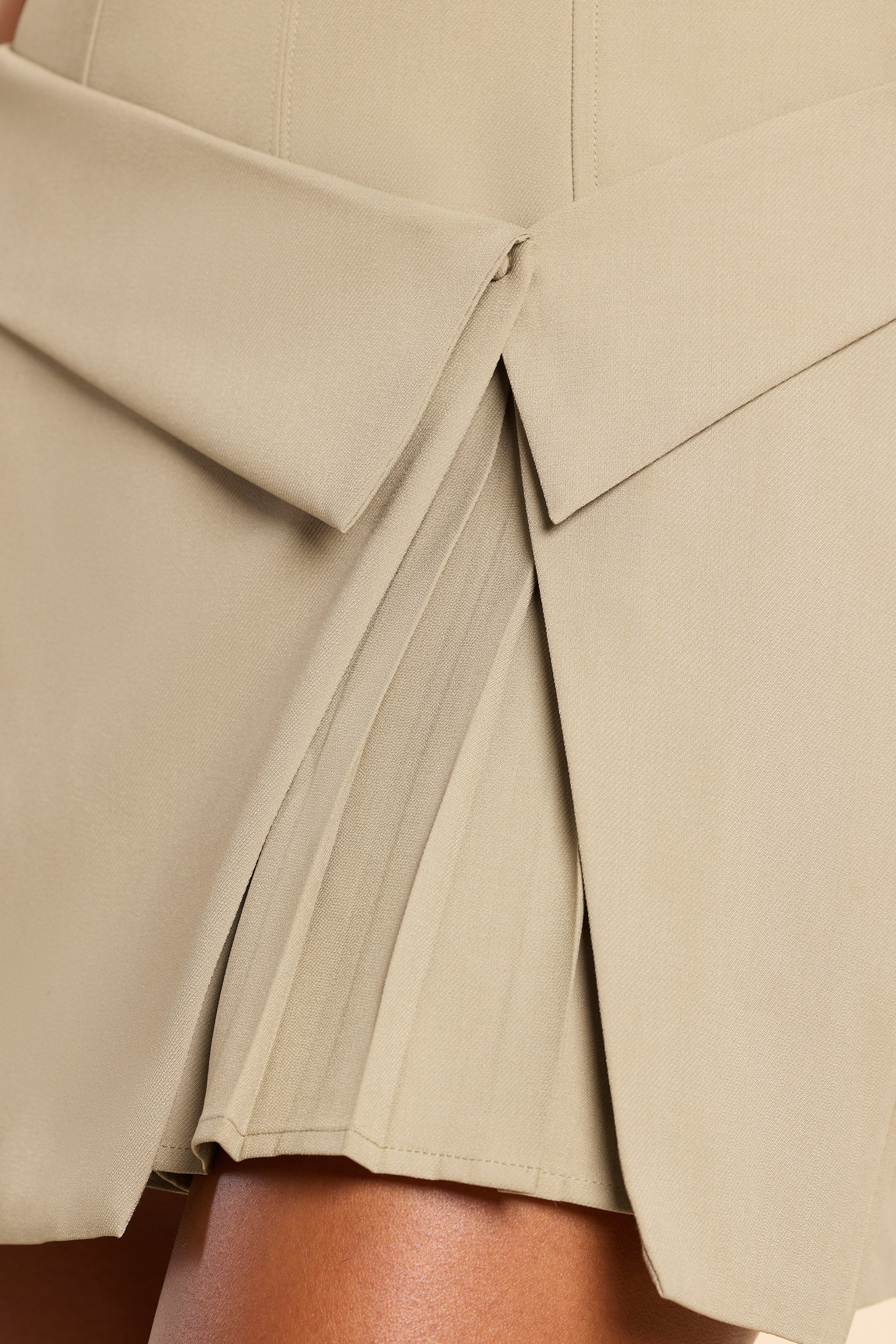 Bruna Woven Twill Wrap Over Pleated Mini Dress in Taupe - Image 7