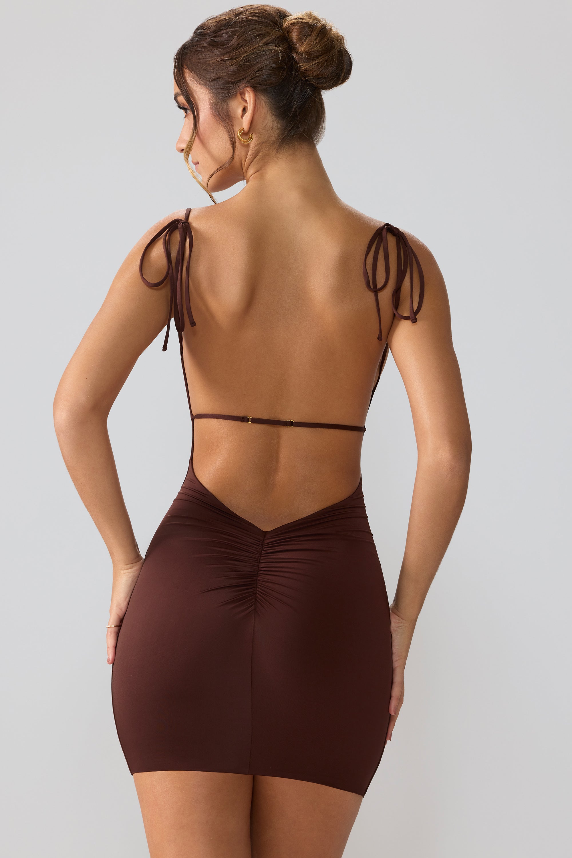 Orli Slinky Jersey Asymmetric Neckline Open Back Mini Dress in Brown - Image 9