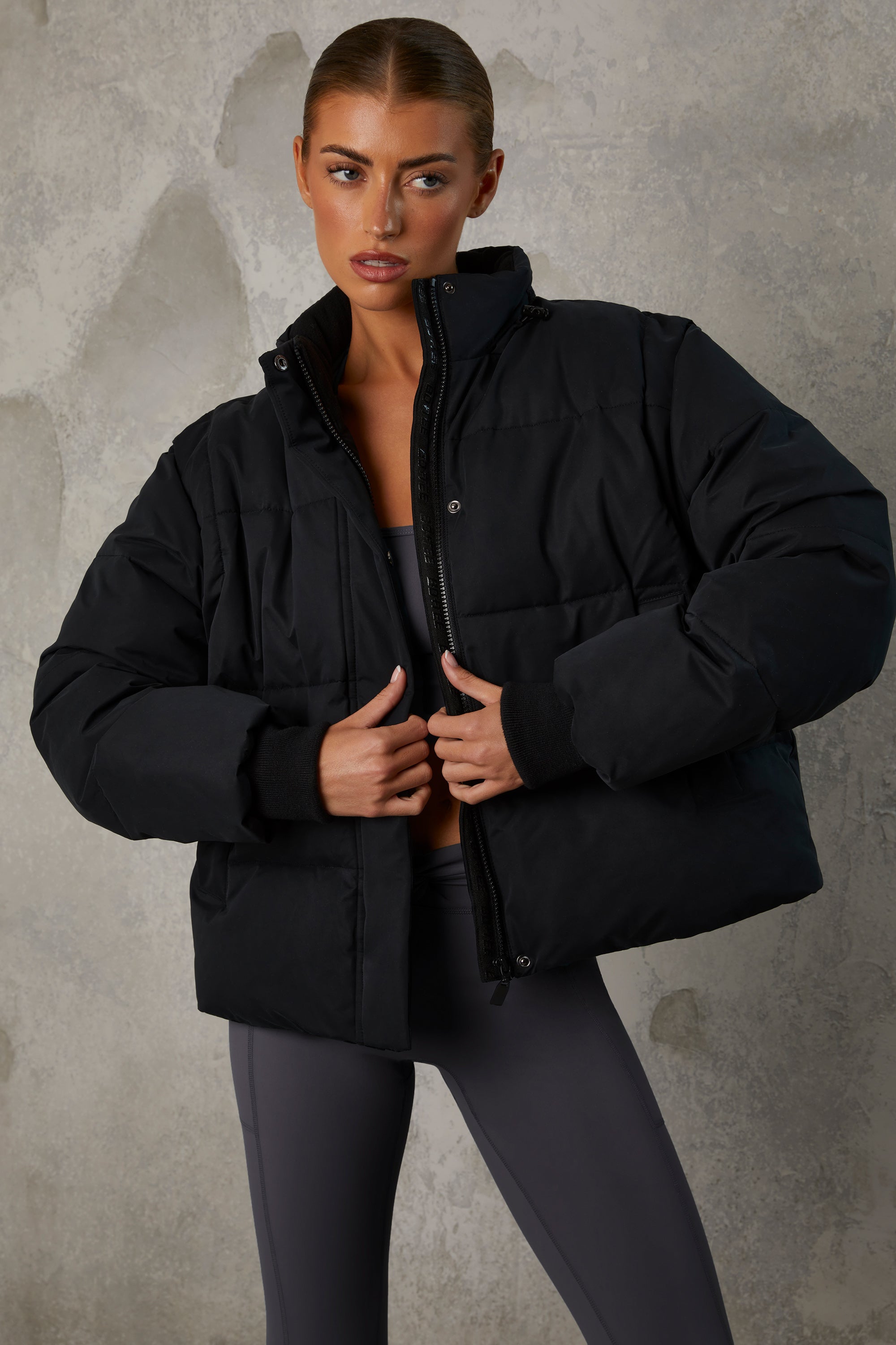 Essential Cropped Puffer Jacket with Detachable Sleeves in Black - Image 12