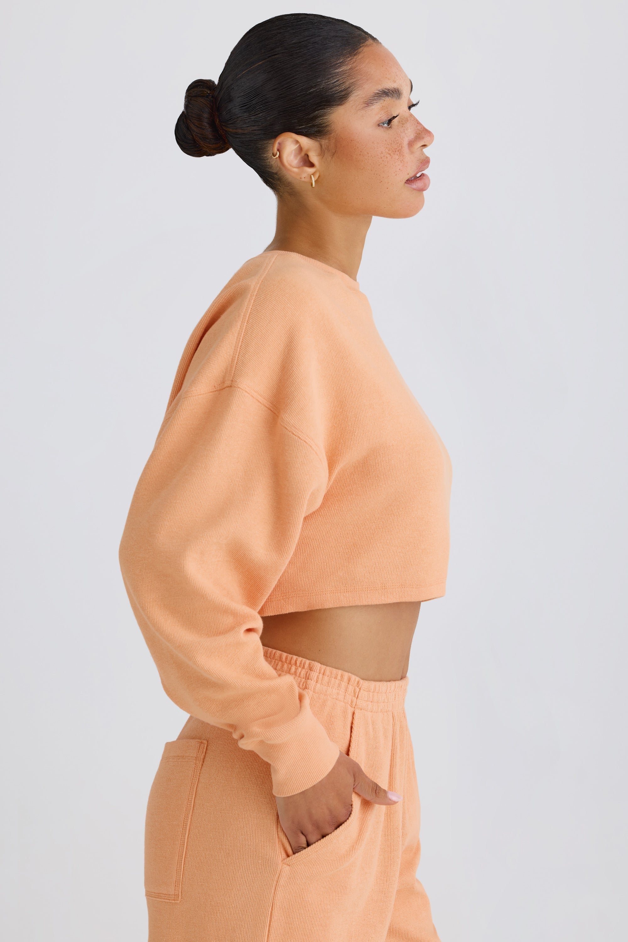 Jet Set Crew-Neck Open-Back Cropped Sweatshirt in Peach - Image 3