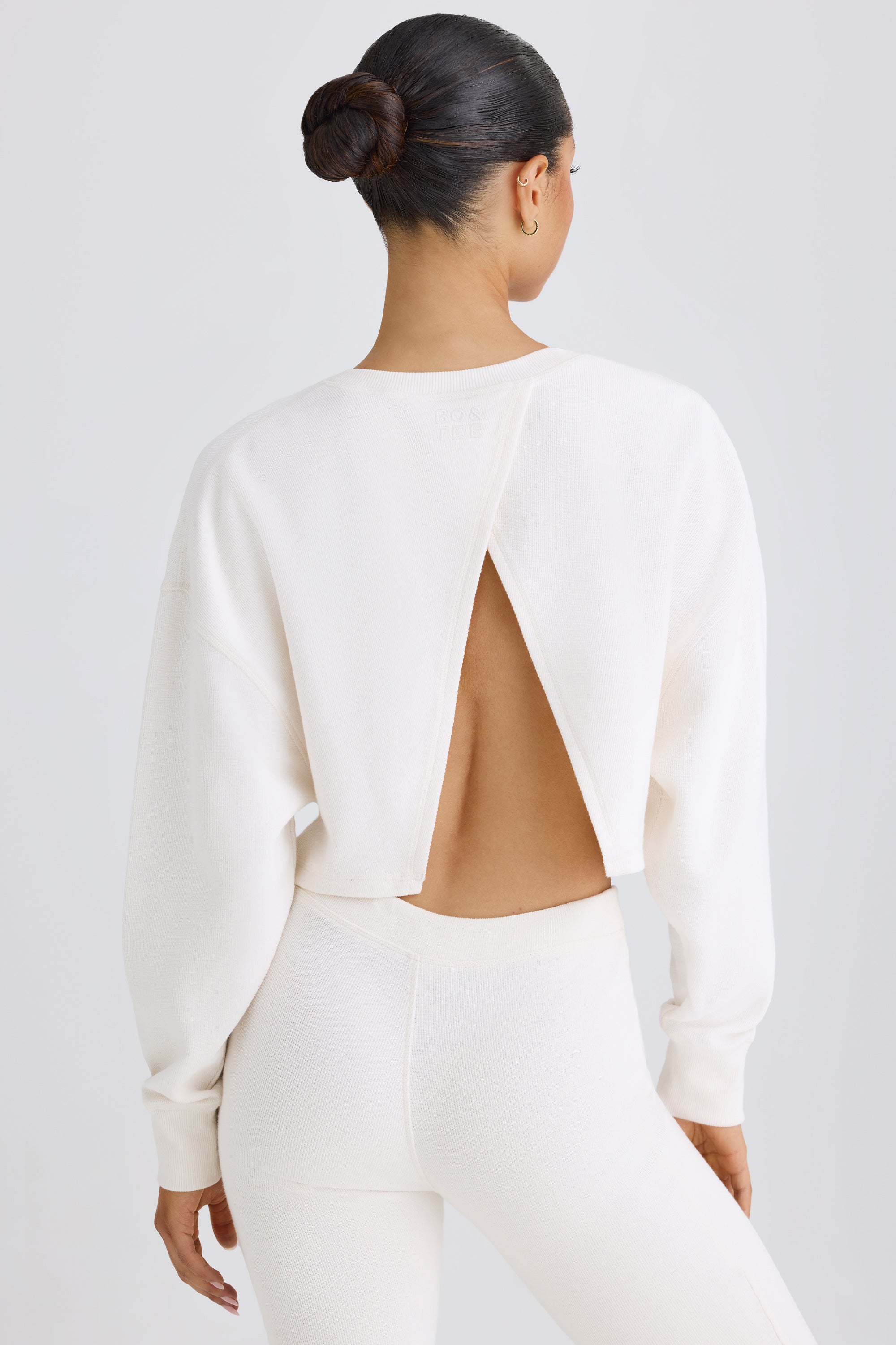 Jet Set Crew-Neck Open-Back Cropped Sweatshirt in White - Image 8