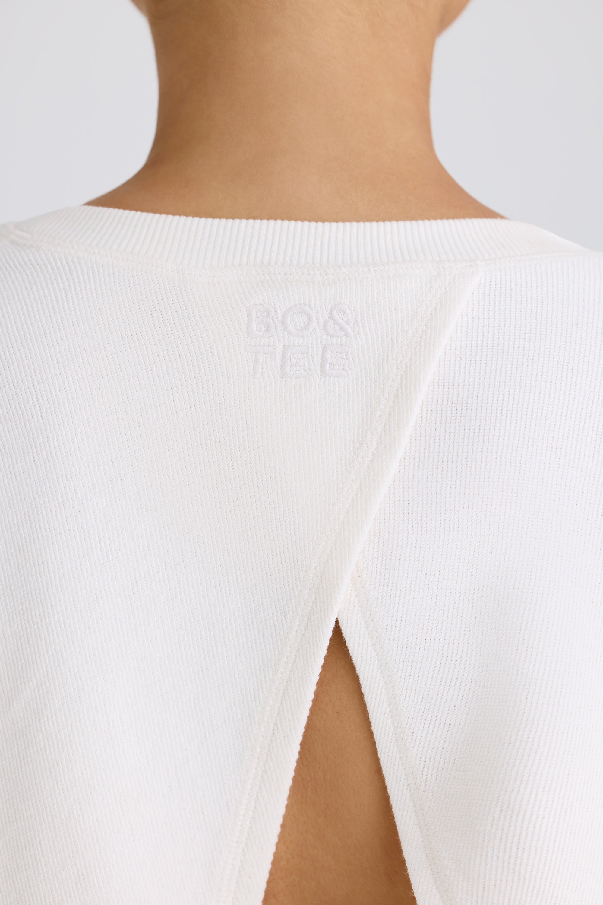 Jet Set Crew-Neck Open-Back Cropped Sweatshirt in White - Image 4