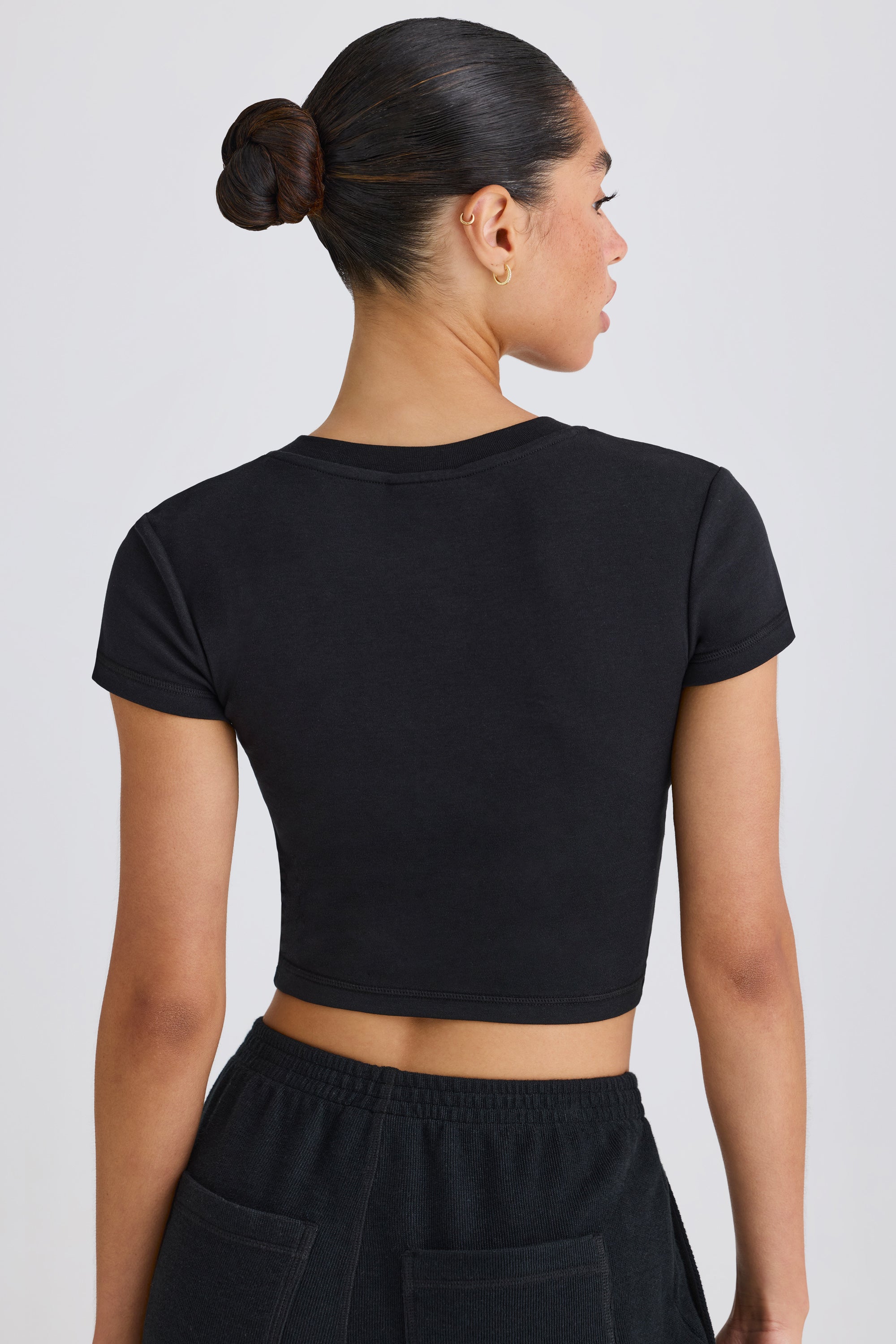 Jet Set Graphic-Print Cropped T-Shirt in Black - Image 2