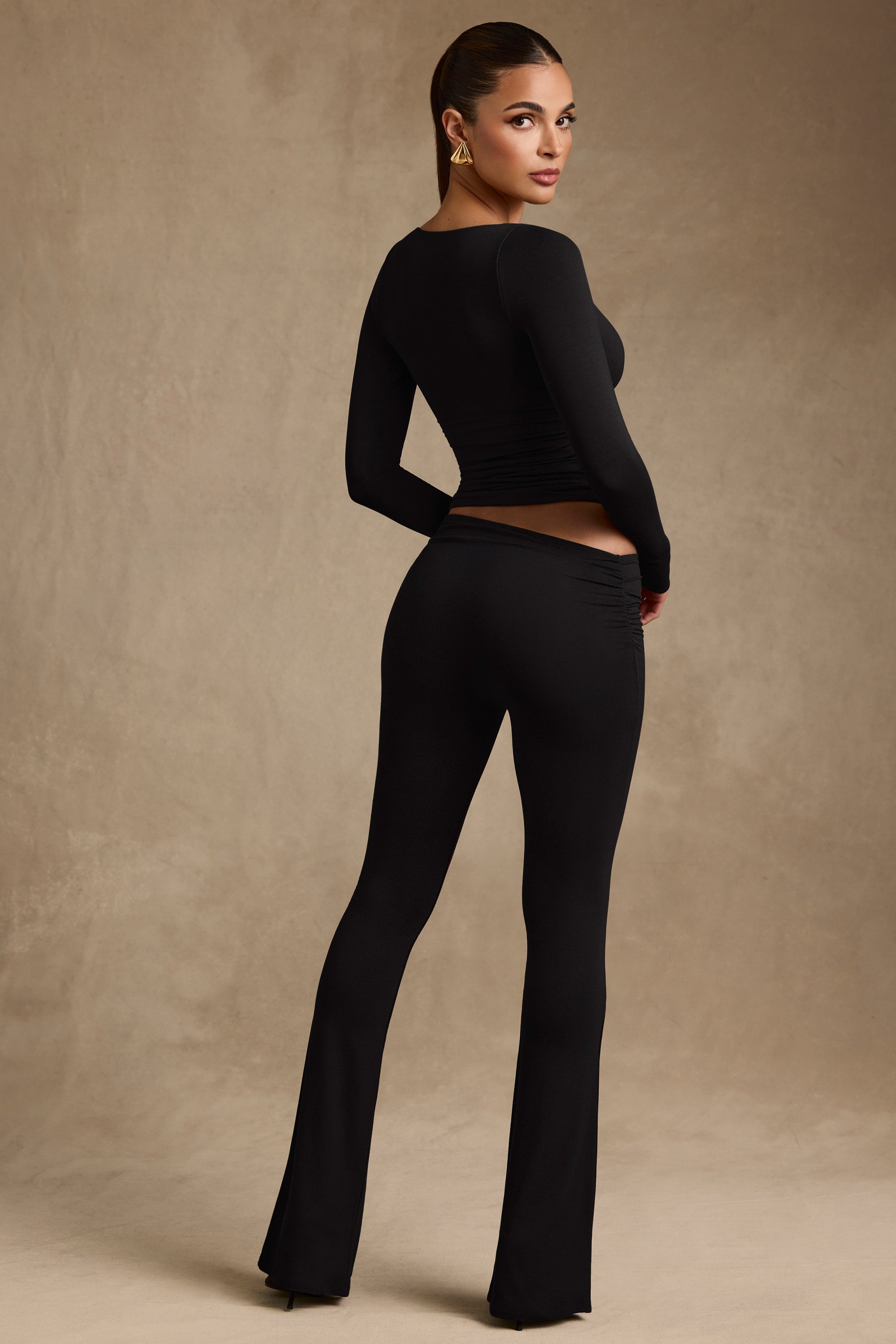 Kalei Modal Asymmetric-Waist Flared Trousers in Black - Image 2