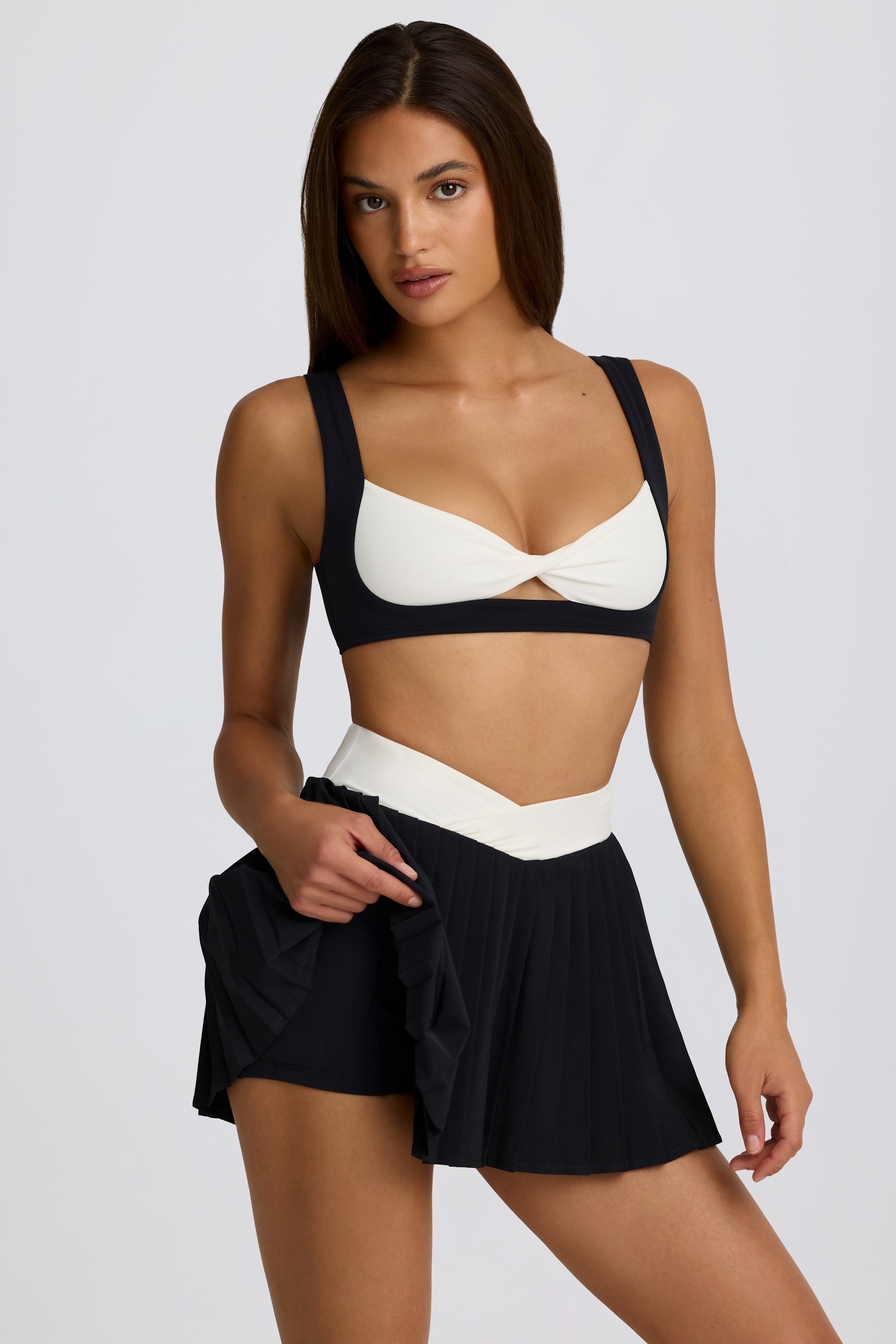 Soft Active Crossover Pleated Mini Skort in Black - Image 4