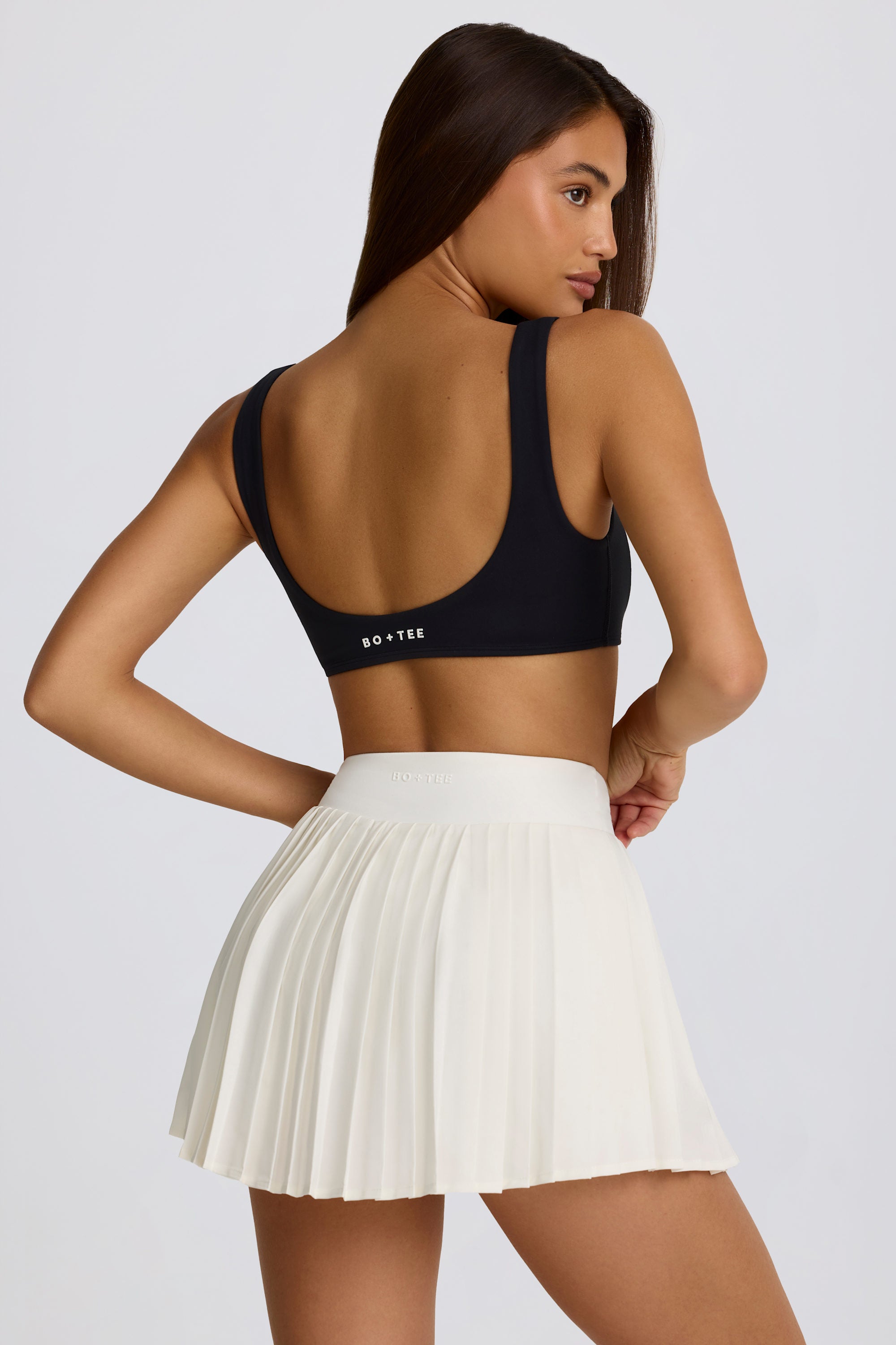 Soft Active Crossover Pleated Mini Skort in Ivory - Image 2