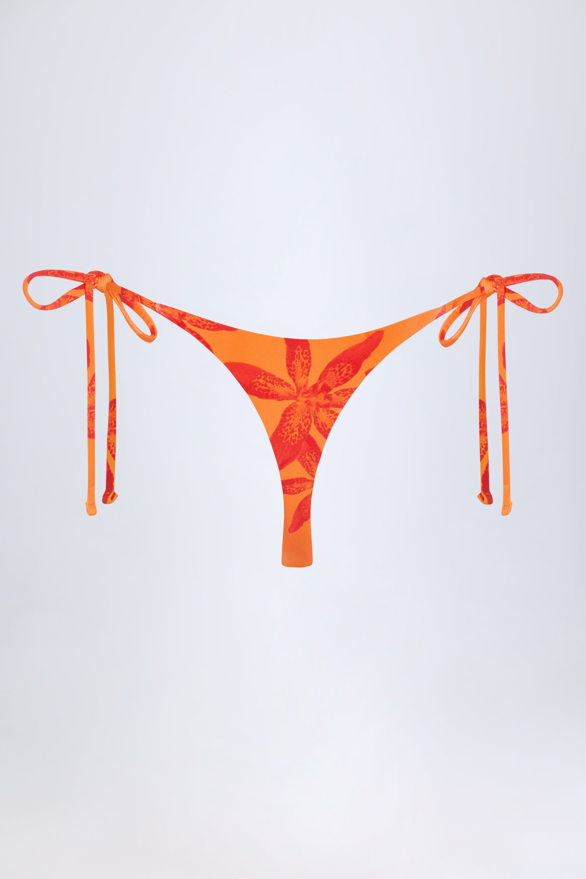 Moheli Side-Tie Thong Bikini Bottoms in Orange Orchid Print - Image 4