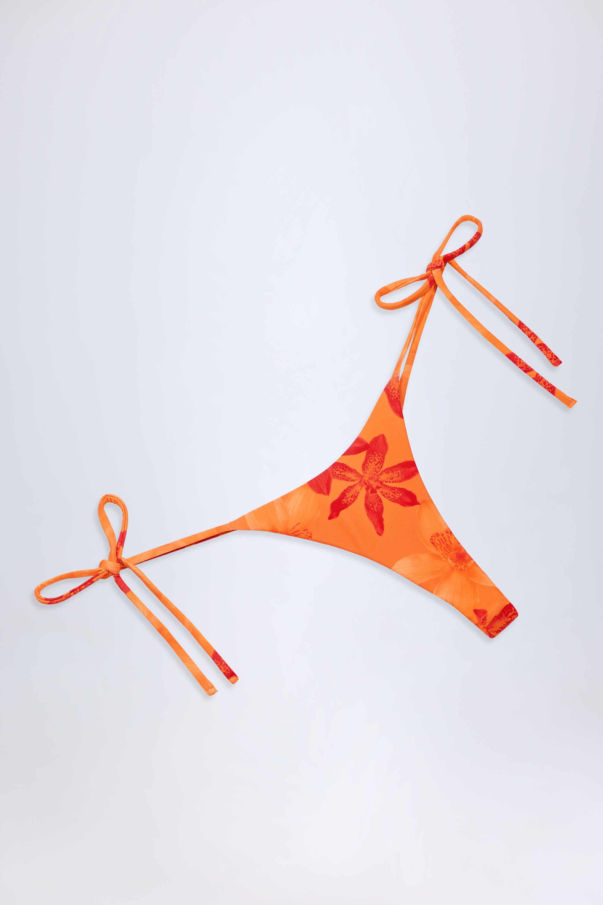 Moheli Side-Tie Thong Bikini Bottoms in Orange Orchid Print - Image 5